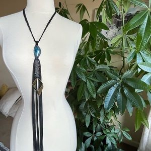 Handmade necklace w precious stone wrapped in beads